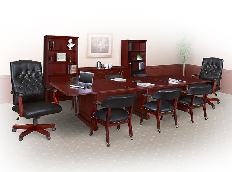 2 tradional swivel chairs with 6 black captain chairs around a prestige mahogany conference table.
