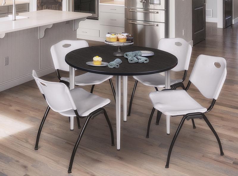 set of 4 stacking chairs with a round 48 breakroom table with chrome legs on a light wood floor