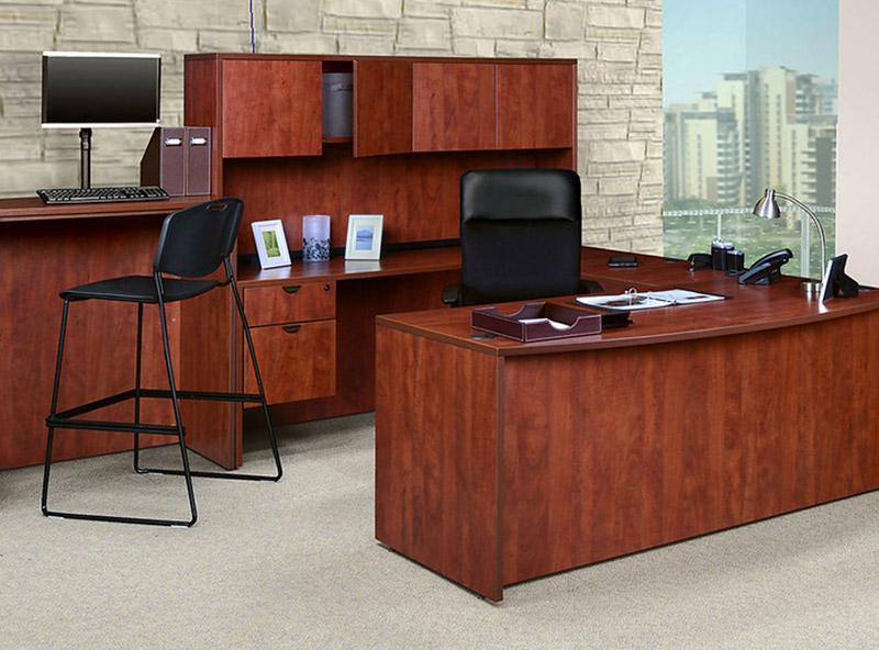 Classic cherry U desk Workstation with an L desk return in an office setting