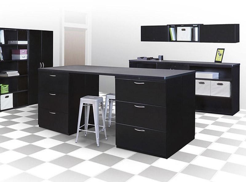 2 Black file cabinets on checkered floor with 2 black stacking stools next to a wall shelf and fabric bins