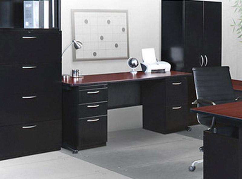 2 black cabinets and dresser next to a fusion teacher desk that has two black pedestals
